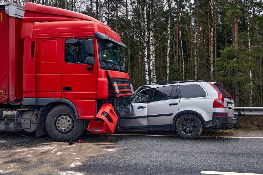 Collison between a car and truck